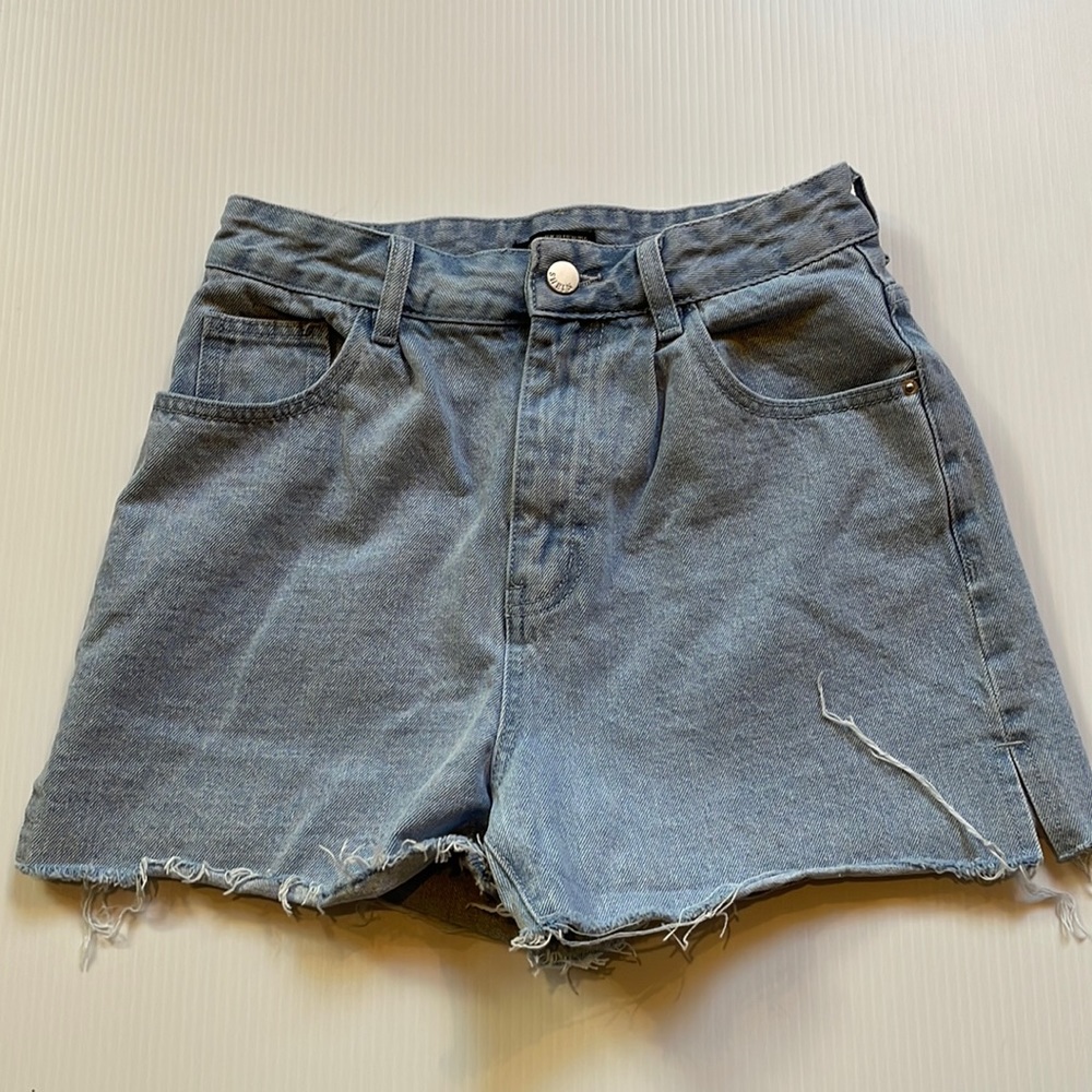 Shein light blue denim, cut off pleated jean shorts.  Women’s size 28